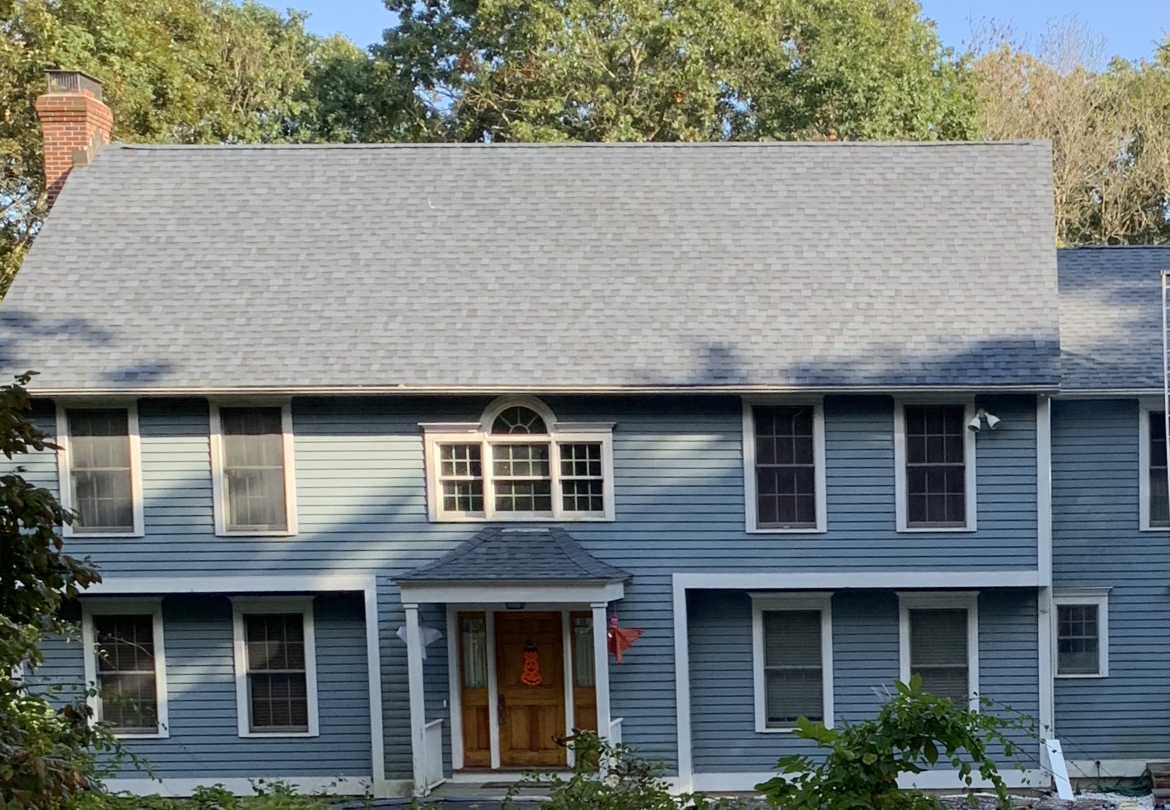 cornflower blue siding with grey asphalt roof